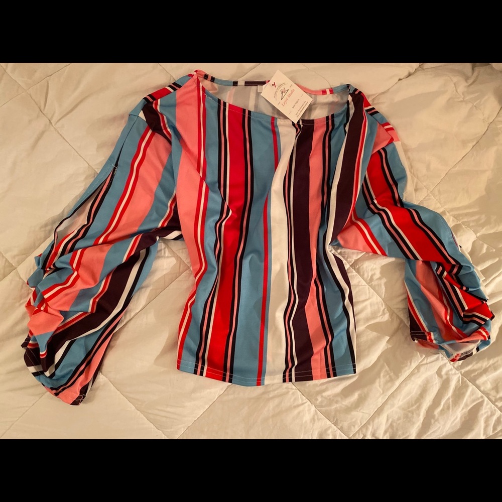 Vertical stripe top with back tie. Puffy sleeves